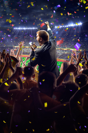Fans on stadium soccer game Confetti and tinselの写真素材