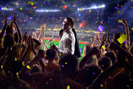 Fans on stadium soccer game Confetti and tinselの写真素材