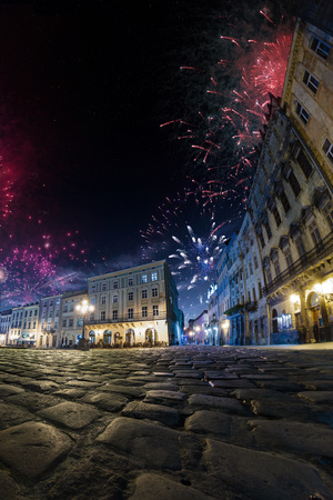 Celebration City background with Fireworks. Empty night plaza, old architecture. Festivalの写真素材