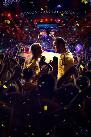 Fans on basketball court in game Confetti and tinselの写真素材