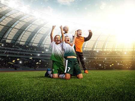 winning football player Children after score in a matchの写真素材
