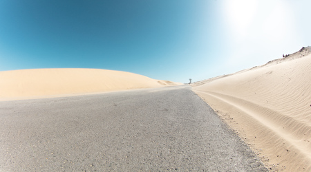 asphalt road desert landscape very wide angleの写真素材