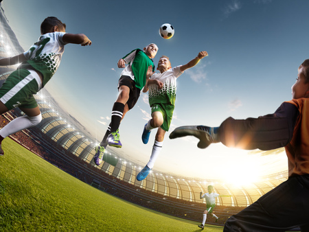children soccer player in action in stadiumの写真素材