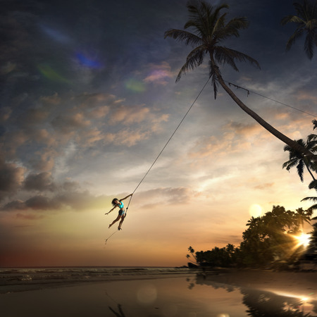 woman jump in ocean bungeeの写真素材