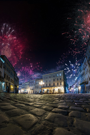 Celebration City background with Fireworks. Empty night plaza, old architecture. Festivalの写真素材