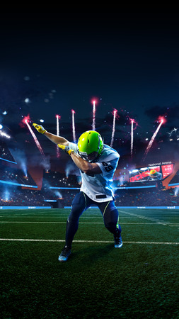 American football player celebrate tocuhdown on stadium. Sport wallpaper or advertisingの写真素材