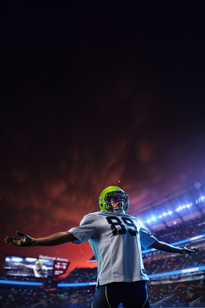 American football player celebrate tocuhdown on stadium. Sport wallpaper or advertisingの写真素材