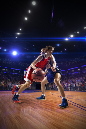 Basketball player n action. around Arena with blue light spotの写真素材