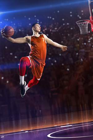 Basketball player in jump. around Arena with blue light spot