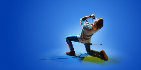 Rock star celebrity blue background isolatedの写真素材