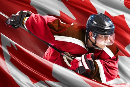 Canada Hockey Player in action around national flagsの写真素材