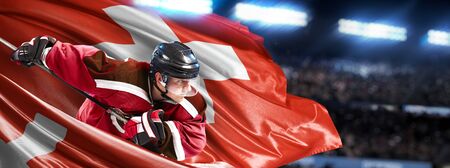 Switzerland Hockey Player in action around national flagsの写真素材