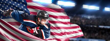 USA Hockey Player in action around national flagsの写真素材