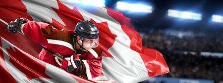 Canada Hockey Player in action around national flagsの写真素材
