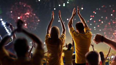 Fans celebrate in Stadium Arena night fireworksの写真素材