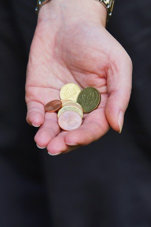 Money in a beautiful female handの写真素材