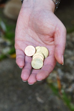 Money in a beautiful female handの写真素材