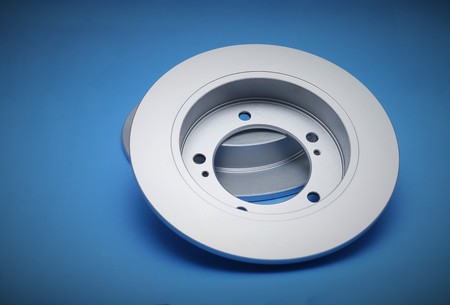 New brake discs on a blue backgroundの写真素材