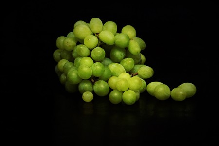Grapes on black background