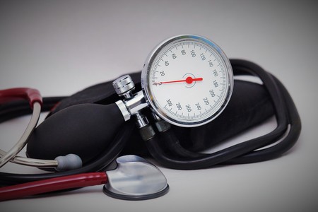 Blood pressure meter and stethoscope on white backgroundの写真素材