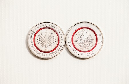 Five euro coin with a red polymer ringの写真素材