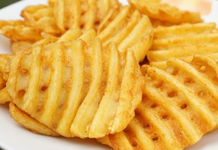 Potato slices isolated on a white backgroundの写真素材