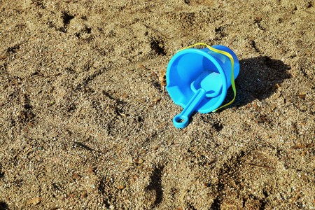 Childrens toys leave on a children's playgroundの写真素材