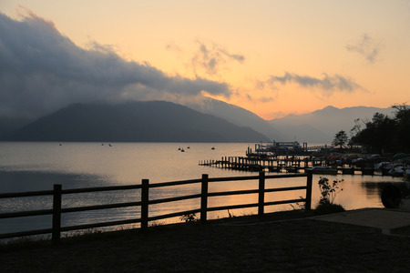 Duck pedal boat pier at sunset at Chuzenji lake, Nikko, Japanのeditorial素材