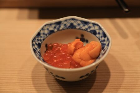 Closeup of raw sea urchin and salmon roe serve in small bowlの写真素材