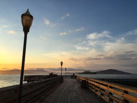 Sunset at wooden pier in San Francisco, United Statesの写真素材