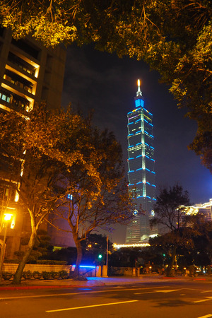 Street view at night with Taipei 101 in a background in Taipei, Taiwanのeditorial素材