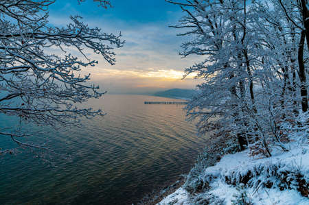 Pier in Gdynia Orlowo seen from cliffs covered with snow. Winter landscapeの写真素材