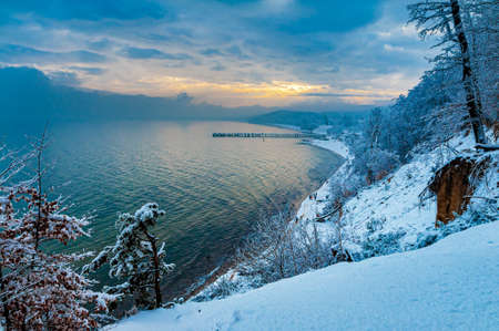 Pier in Gdynia Orlowo seen from cliffs covered with snow. Winter landscapeの写真素材
