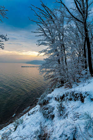 Pier in Gdynia Orlowo seen from cliffs covered with snow. Winter landscapeの写真素材