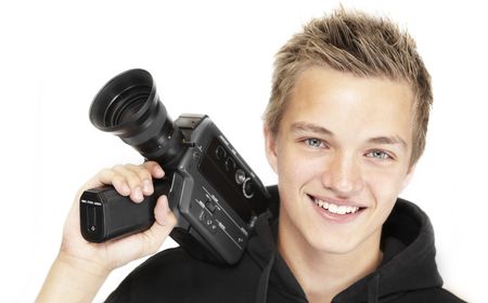 A young photographer with a 8mm camera