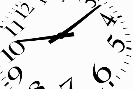 time is now black on a white backgroundの写真素材