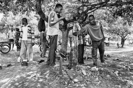 PORTO-NOVO, BENIN - MAR 8, 2012: Unidentified Beninese people. People of Benin suffer of poverty due to the difficult economic situation.のeditorial素材