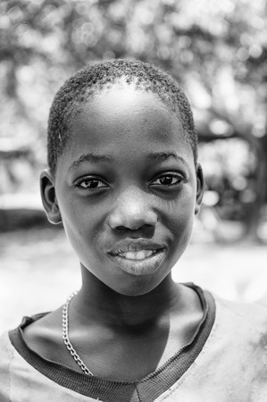 PORTO-NOVO, BENIN - MAR 8, 2012: Portrait of unidentified Beninese beautiful girl. People of Benin suffer of poverty due to the difficult economic situation.のeditorial素材