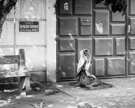 PORTO-NOVO, BENIN - MAR 8, 2012: Unidentified Beninese woman waves to the camera. People of Benin suffer of poverty due to the difficult economic situation.のeditorial素材