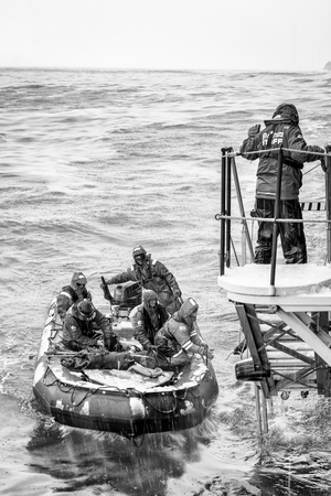 SOUTH GEORGIA, GREAT BRITAIN - NOV 9, 2012: Unidentified group of people in a water proof suit in a rubber boat with a motor in the Atlantic Ocean. Atlantic Ocean is the world's second largest oceanのeditorial素材