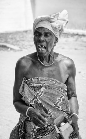 KARA, TOGO - MAR 9, 2013: Unidentified Togolese angry woman creams. People in Togo suffer of poverty due to the unstable econimic situationのeditorial素材
