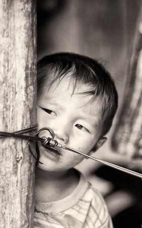 CATCAT VILLAGE, VIETMAN - SEP 12, 2014: Unidentified Vietnamese boy portrait in the Catcat village, Vietnam. 86 of Vietnamese people belong to the Viet ethnic groupのeditorial素材