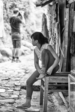 CATCAT VILLAGE, VIETMAN - SEP 12, 2014: Unidentified Vietnamese woman sits in the Catcat village, Vietnam. 86 of Vietnamese people belong to the Viet ethnic groupのeditorial素材