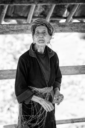 LAO CHAI, VIETMAN - SEP 12, 2014: Unidentified Black Hmong woman in Lao Chai,  Vietnam. Hmong is a ethnic minority group in Vietnamのeditorial素材