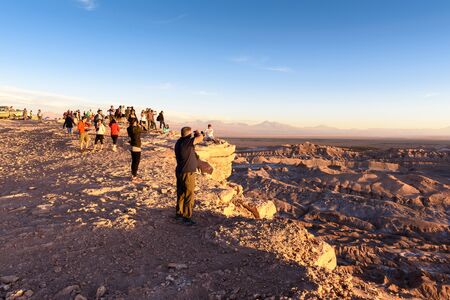 ATACAMA DESERT, CHILE - NOV 3, 2014: Unidentified tourists making pictures in the Atacama desert, Chile. Atacama Desert proper occupies 105,000 square kilometresのeditorial素材