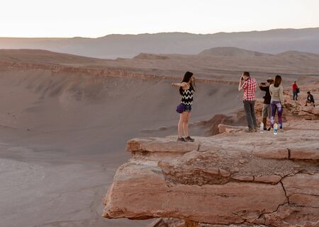 ATACAMA DESERT, CHILE - NOV 3, 2014: Unidentified tourists making pictures in the Atacama desert, Chile. Atacama Desert proper occupies 105,000 square kilometresのeditorial素材
