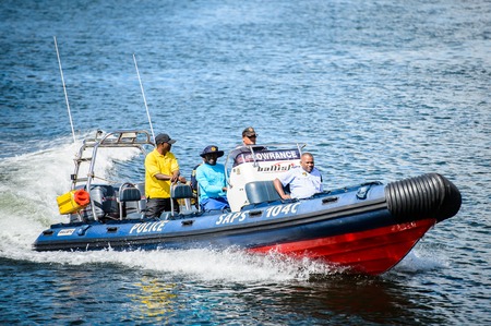 CAPE TOWN, SOUTH AFRICA - FEB 22, 2013: Unidentified people on a boat in the harbor in Cape Town, South Africa. Cape town is the most popular international touristic destination in Africaのeditorial素材