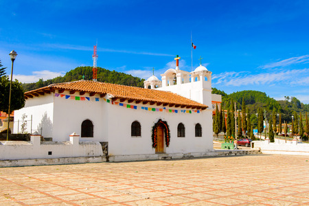Bell building of the San Lorenzo Church (Saint Lawrence), Zinacantan, Chiapas, Mexico. The main religious building of the townの写真素材