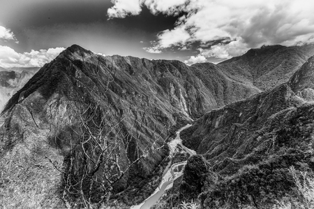 River among two mountainsin black and white, Peruの写真素材