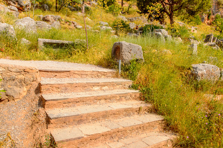 Ancient ruins of Delphi, an archaeological site in Greece, at the Mount Parnassus. Delphi is famous...